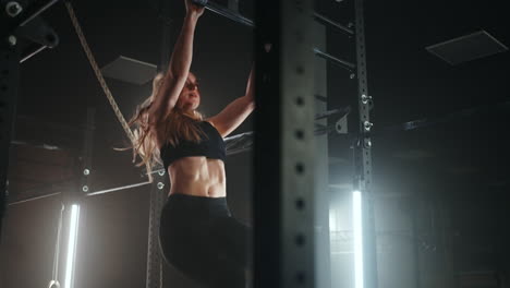 pull-up-on-sport-bar-in-gym-young-beautiful-woman-is-doing-physical-exercises-in-sport-center